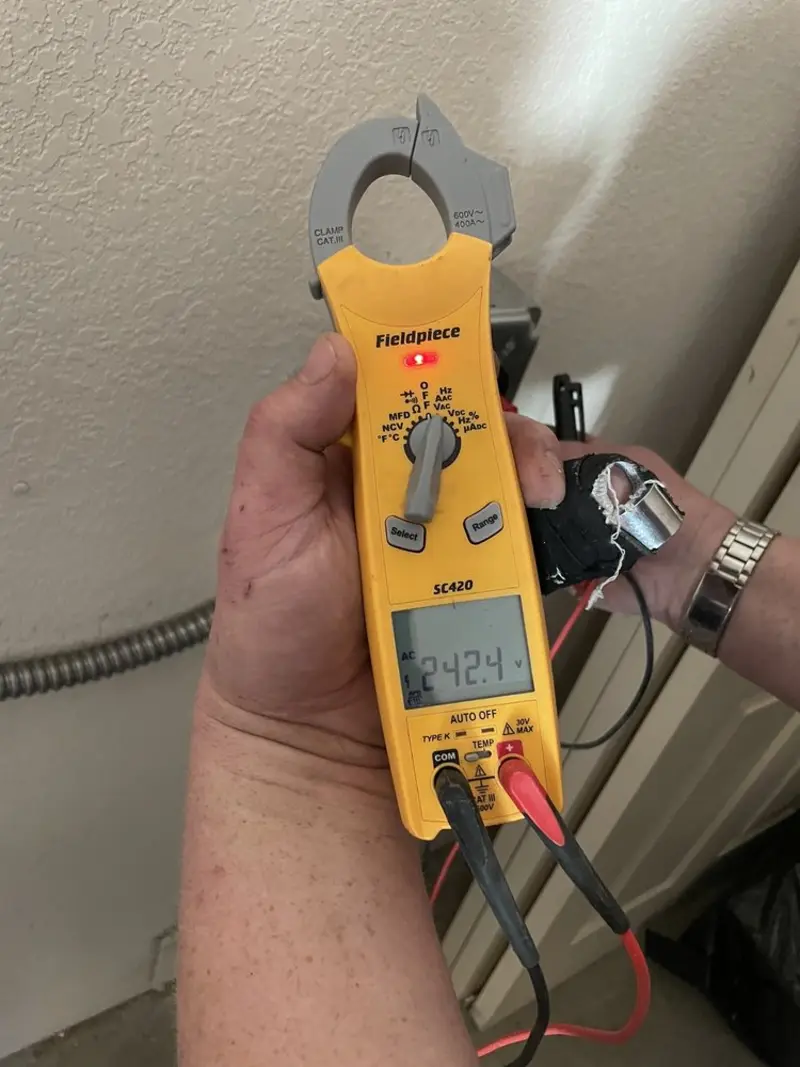 Voltage testing with clamp meter during Aluminum Wiring Replacement in Shirley